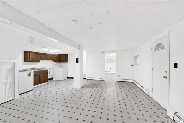 a view of a storage & utility room with a window