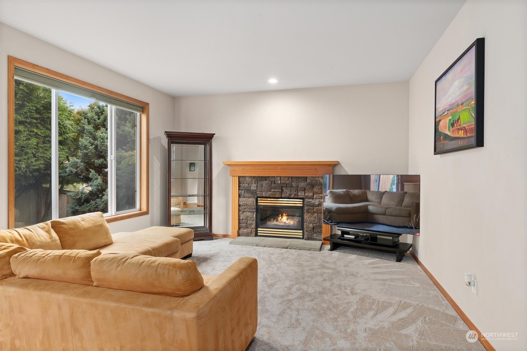 1124 184th Place Southeast Bothell, WA 98012 - Photo 11 of 35 a living room with furniture and a fireplace