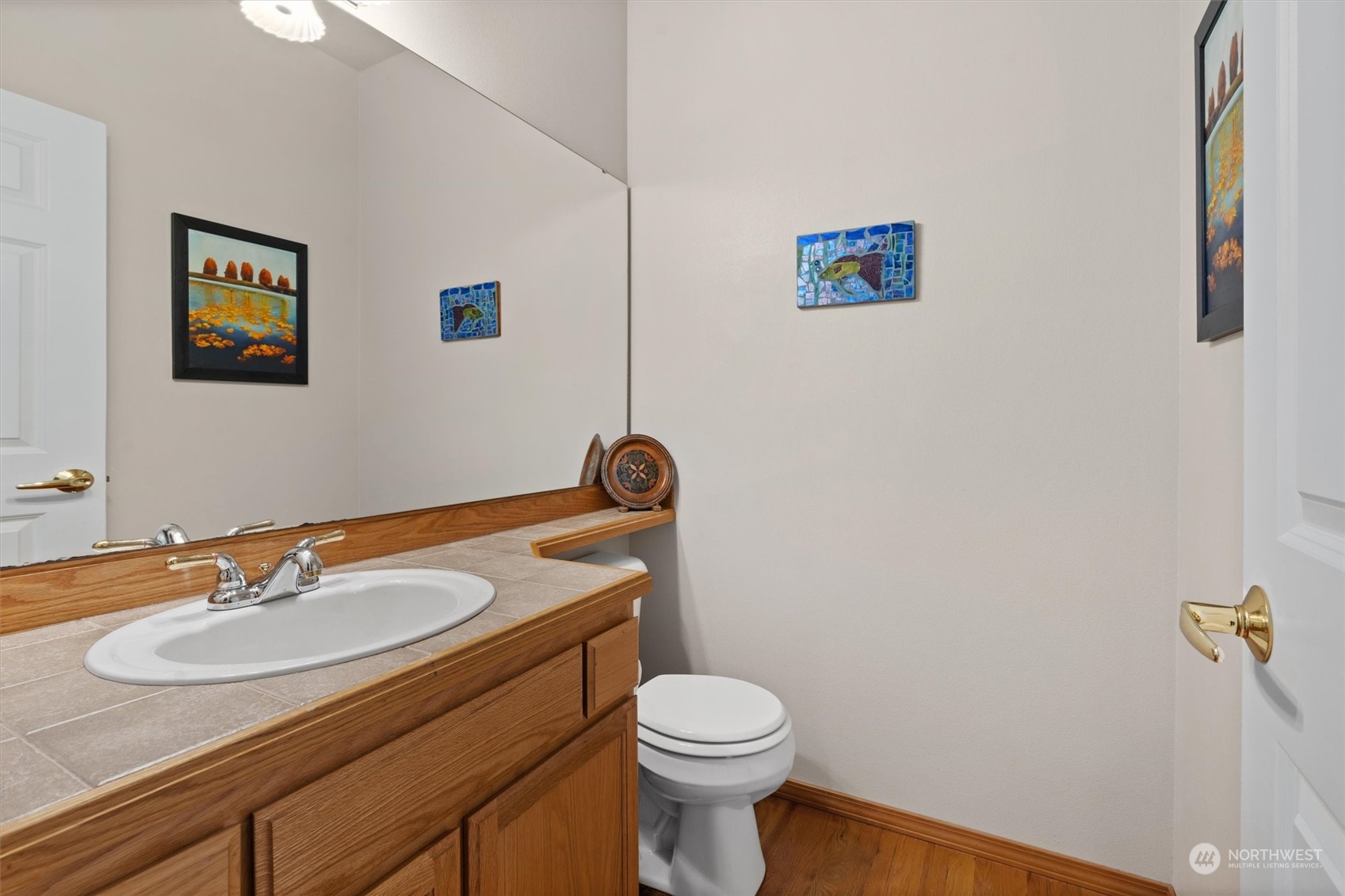 1124 184th Place Southeast Bothell, WA 98012 - Photo 15 of 35 a bathroom with a sink toilet and a mirror