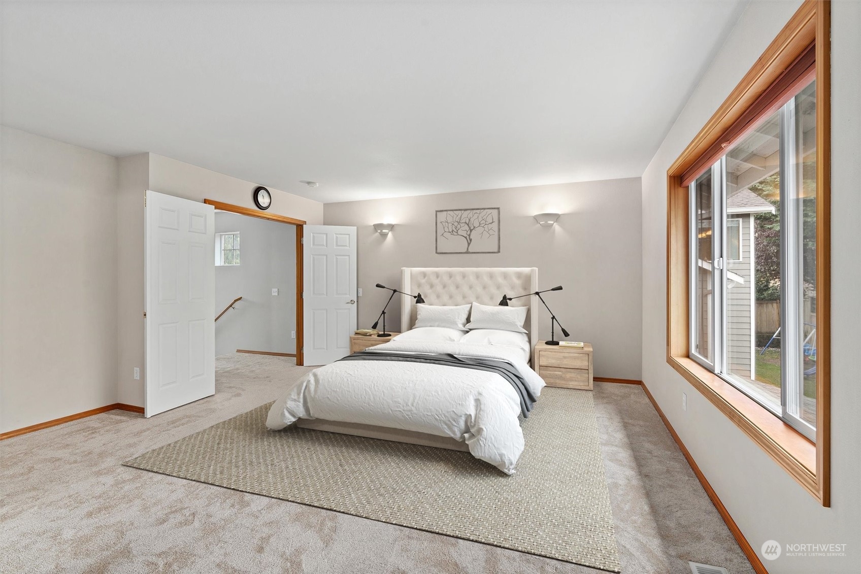 1124 184th Place Southeast Bothell, WA 98012 - Photo 17 of 35 a bedroom with a bed and a large window