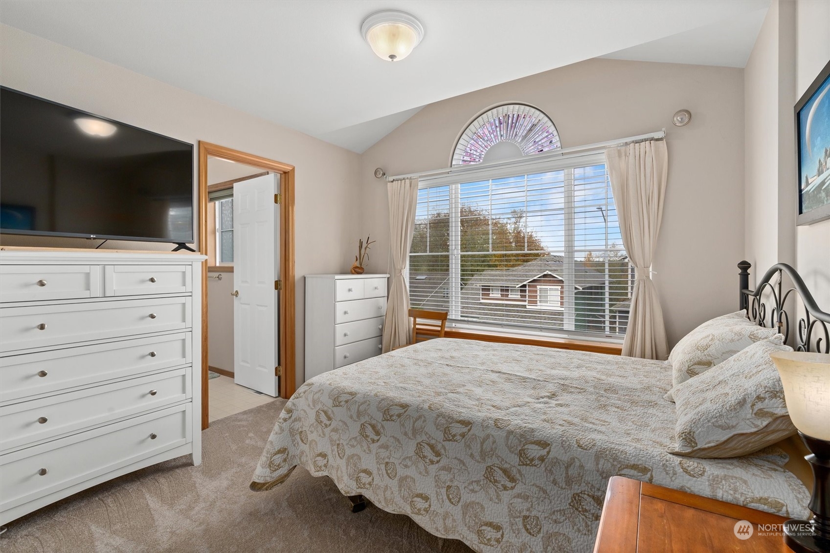 1124 184th Place Southeast Bothell, WA 98012 - Photo 25 of 35 a bedroom with a bed and a flat screen tv