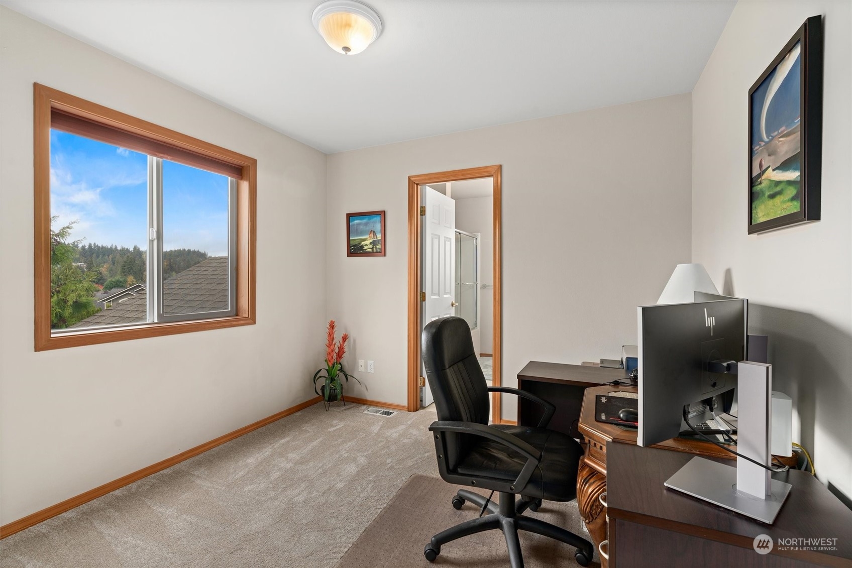 1124 184th Place Southeast Bothell, WA 98012 - Photo 26 of 35 a view of a workspace with furniture and a window