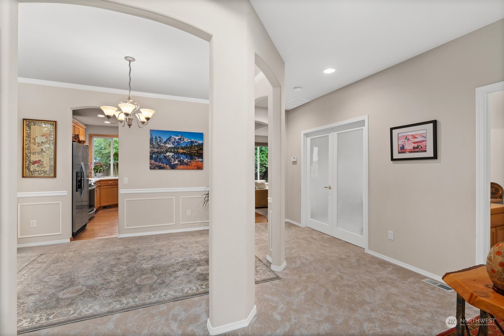 1124 184th Place Southeast Bothell, WA 98012 - Photo 4 of 35 a view of a hallway with furniture and chandelier