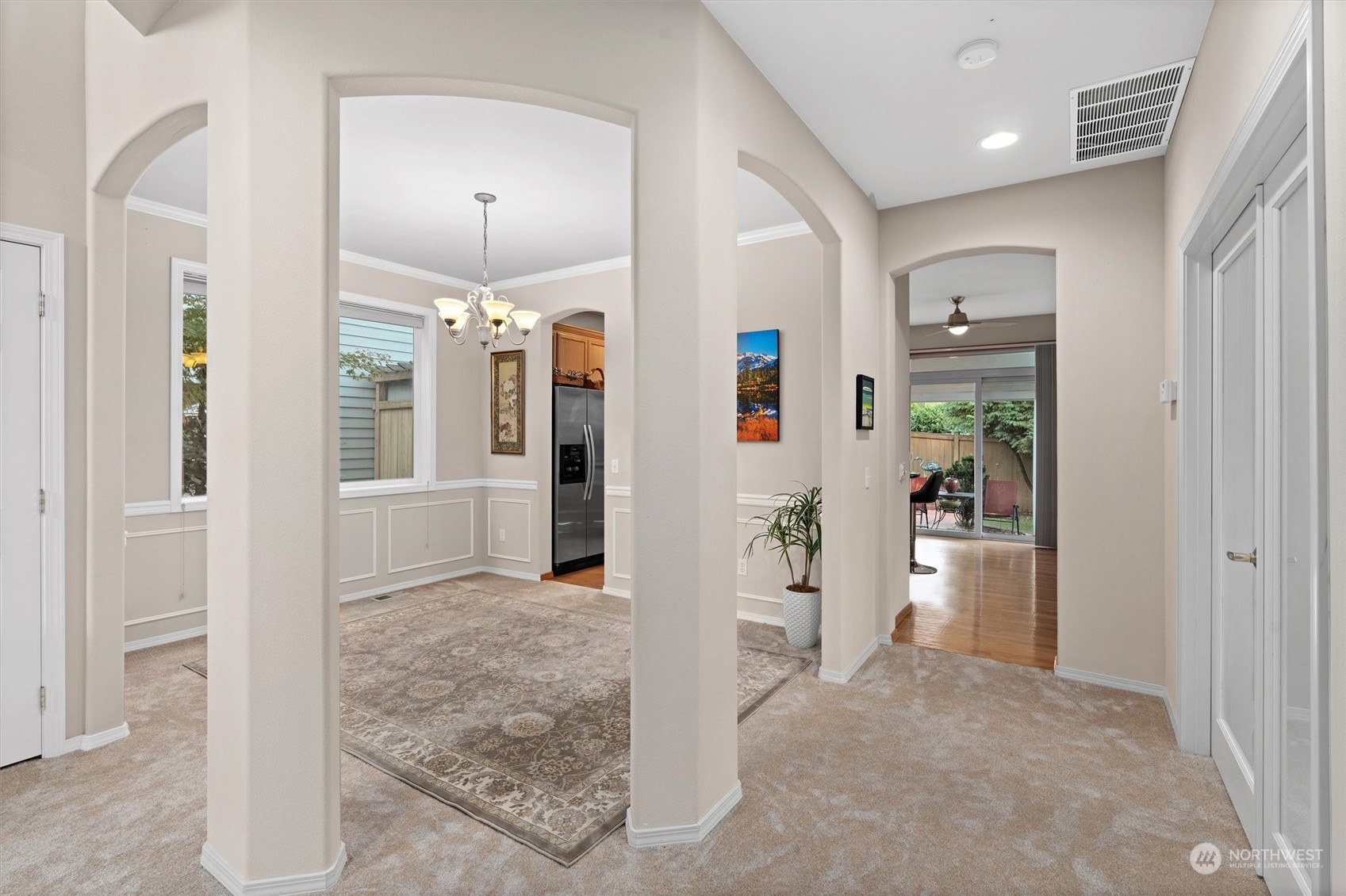 1124 184th Place Southeast Bothell, WA 98012 - Photo 5 of 35 a view of a hallway with living room and dining room