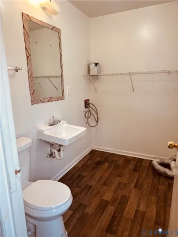 a bathroom with a toilet and a sink