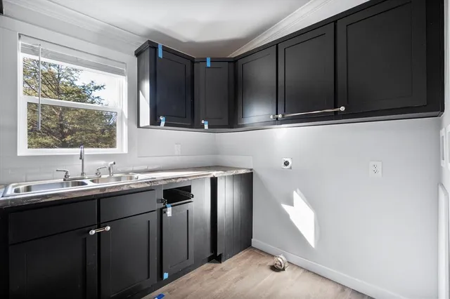 a kitchen with sink and window