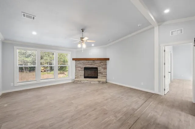 a view of an empty room with a fireplace