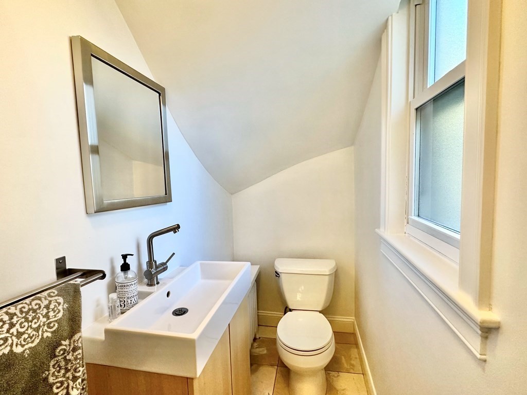 380 Jamaicaway Boston, MA 02130 - Photo 12 of 30 a bathroom with a sink mirror and toilet