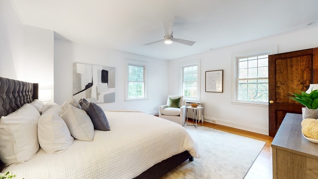 380 Jamaicaway Boston, MA 02130 - Photo 14 of 30 a bedroom with a bed and wooden floor