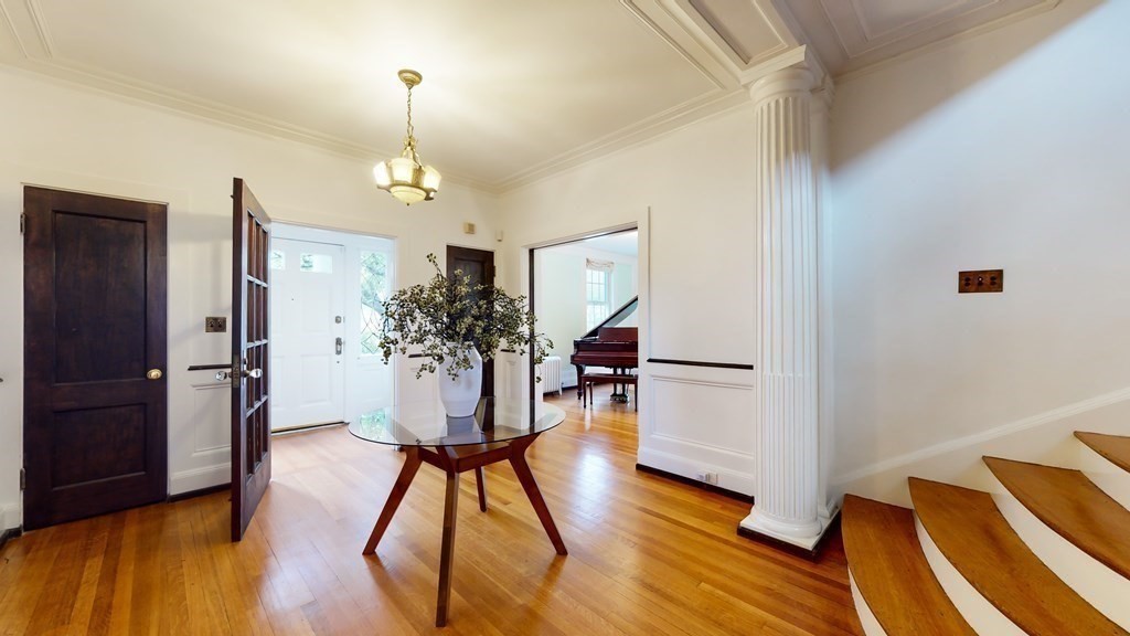 380 Jamaicaway Boston, MA 02130 - Photo 5 of 30 a room with wooden floor and furniture