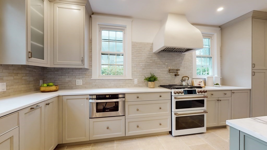 380 Jamaicaway Boston, MA 02130 - Photo 7 of 30 a kitchen with white cabinets and white appliances