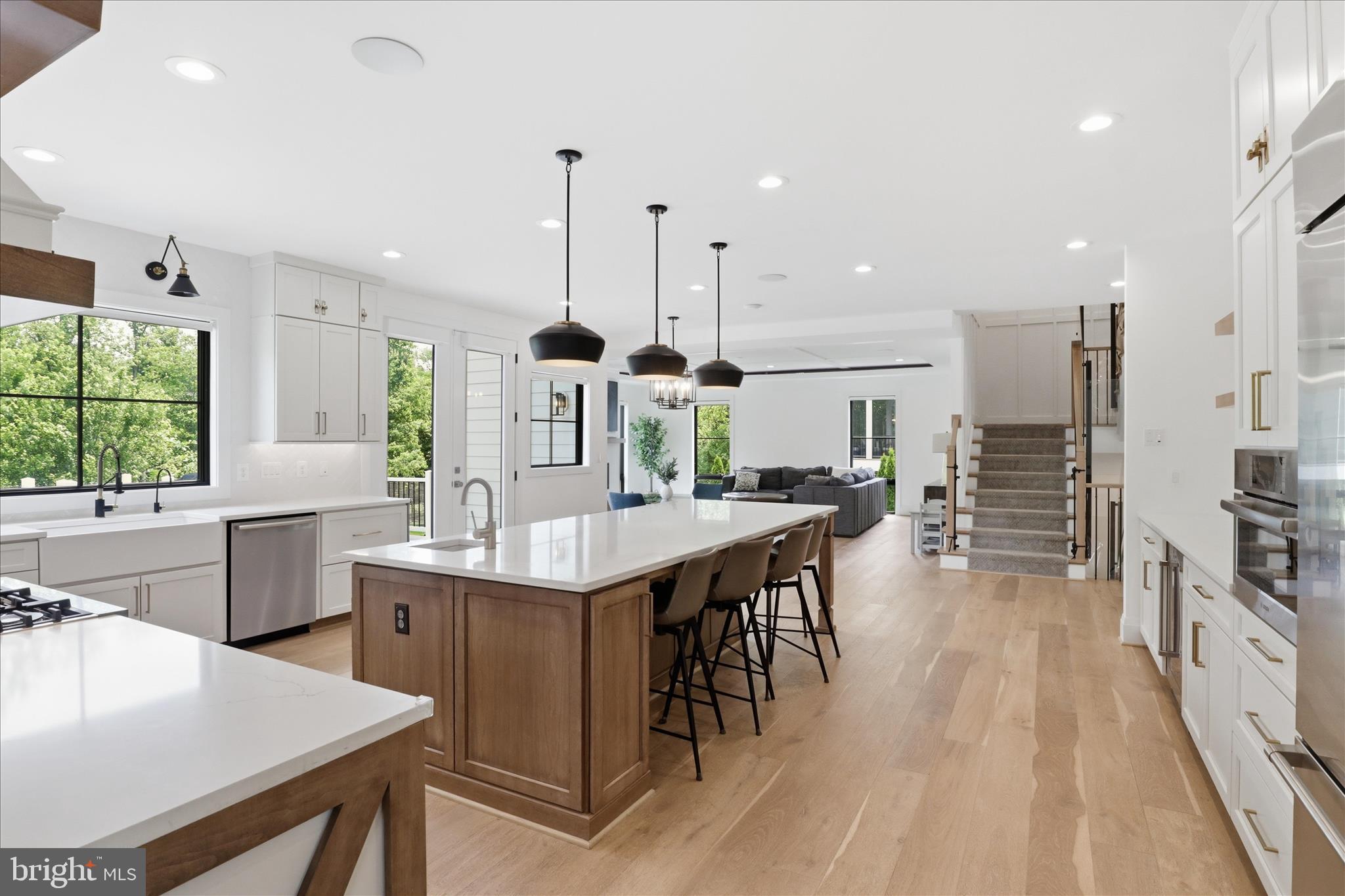 202 Branch Road Southeast Vienna, VA 22180 - Photo 6 of 59 a kitchen with stainless steel appliances granite countertop a kitchen island a stove a table and chairs in it