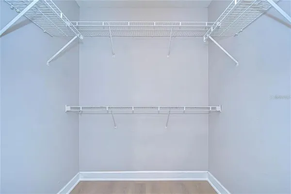 a view of a room with racks on the wall