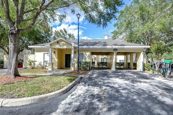 a view of a house with a backyard porch and sitting area