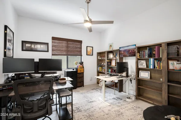 a bedroom with a bed and a television