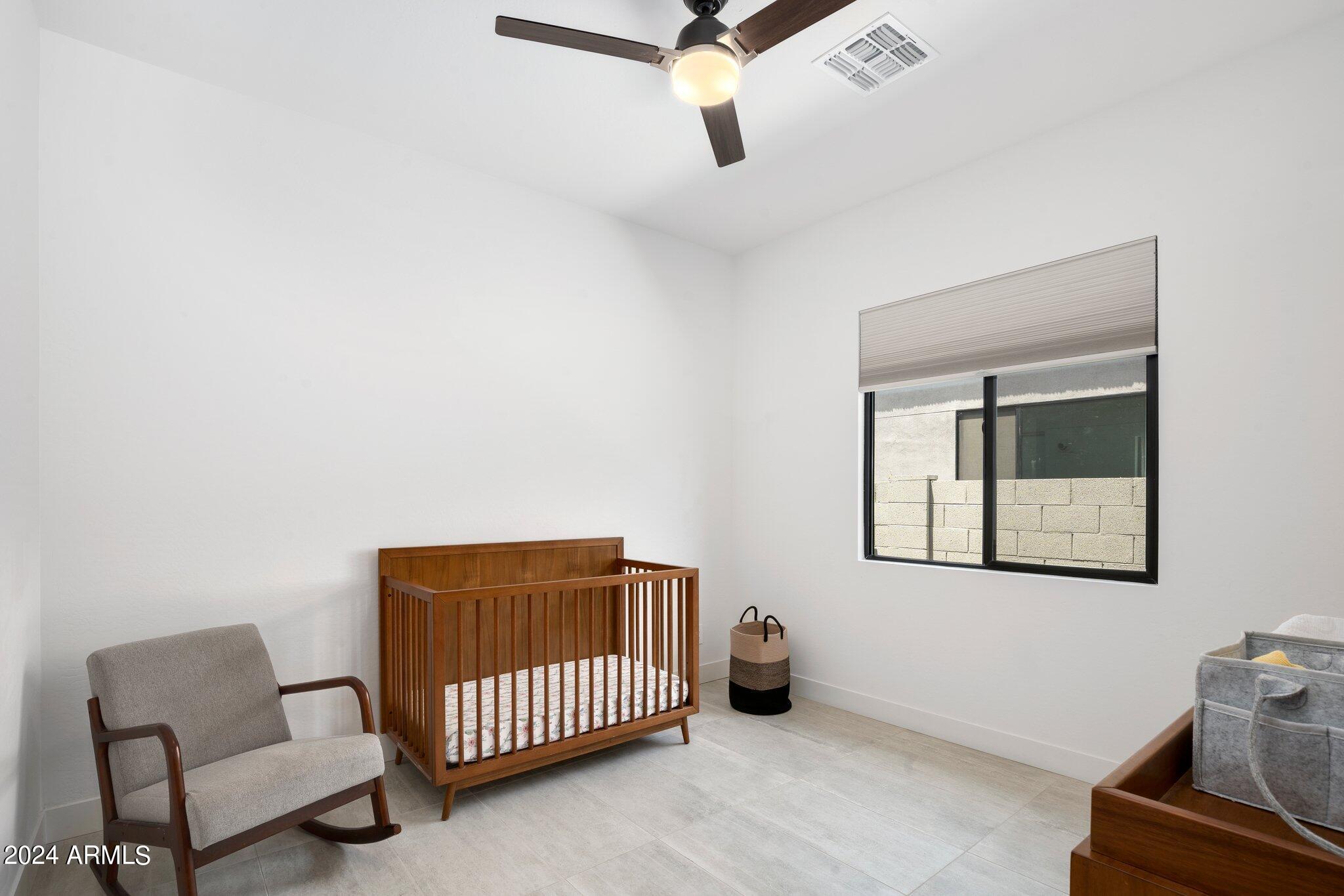 812 East Summerside Road Phoenix, AZ 85042 - Photo 33 of 64 a bedroom with a bed and window