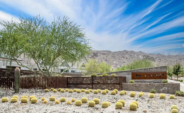 an aerial view of a house with a mountain