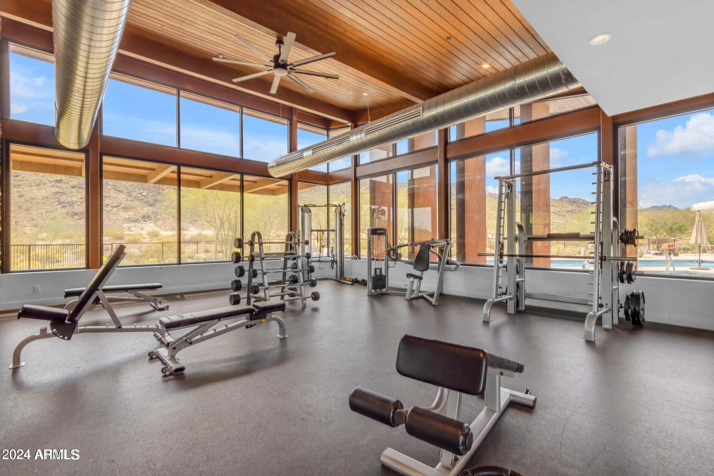 812 East Summerside Road Phoenix, AZ 85042 - Photo 49 of 64 a view of a room with gym equipment and floor to ceiling window