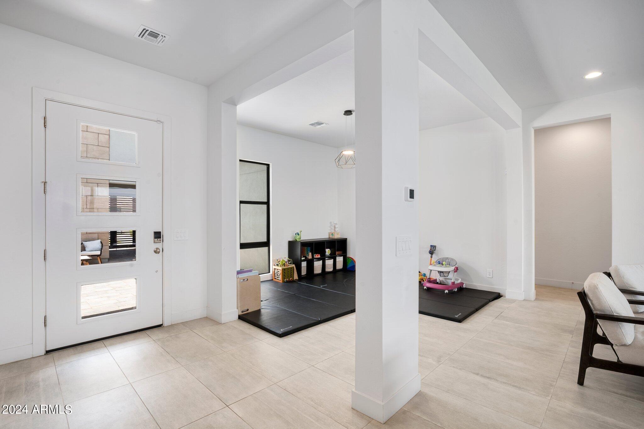 812 East Summerside Road Phoenix, AZ 85042 - Photo 8 of 64 a living room with furniture and wooden floor