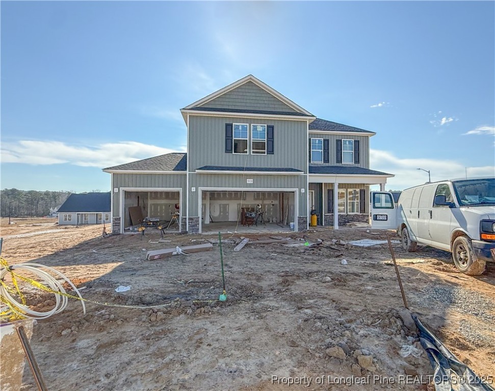 513 Dawn Flower (lot 83) Road Raeford, NC 28376 - Photo 1 of 3 a front view of a house with a yard