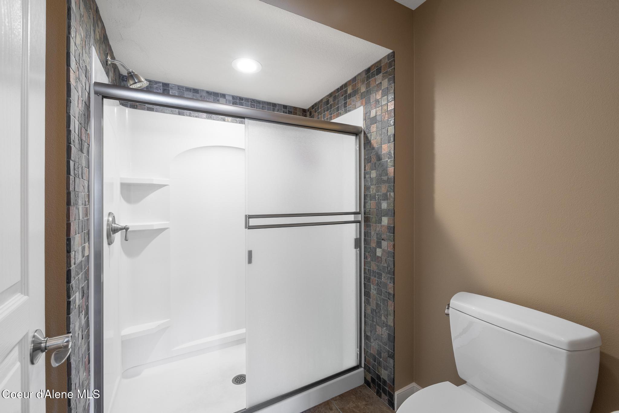 4549 South Arrow Point Drive, Unit 207 Harrison, ID 83833 - Photo 22 of 60 Tiles Shower