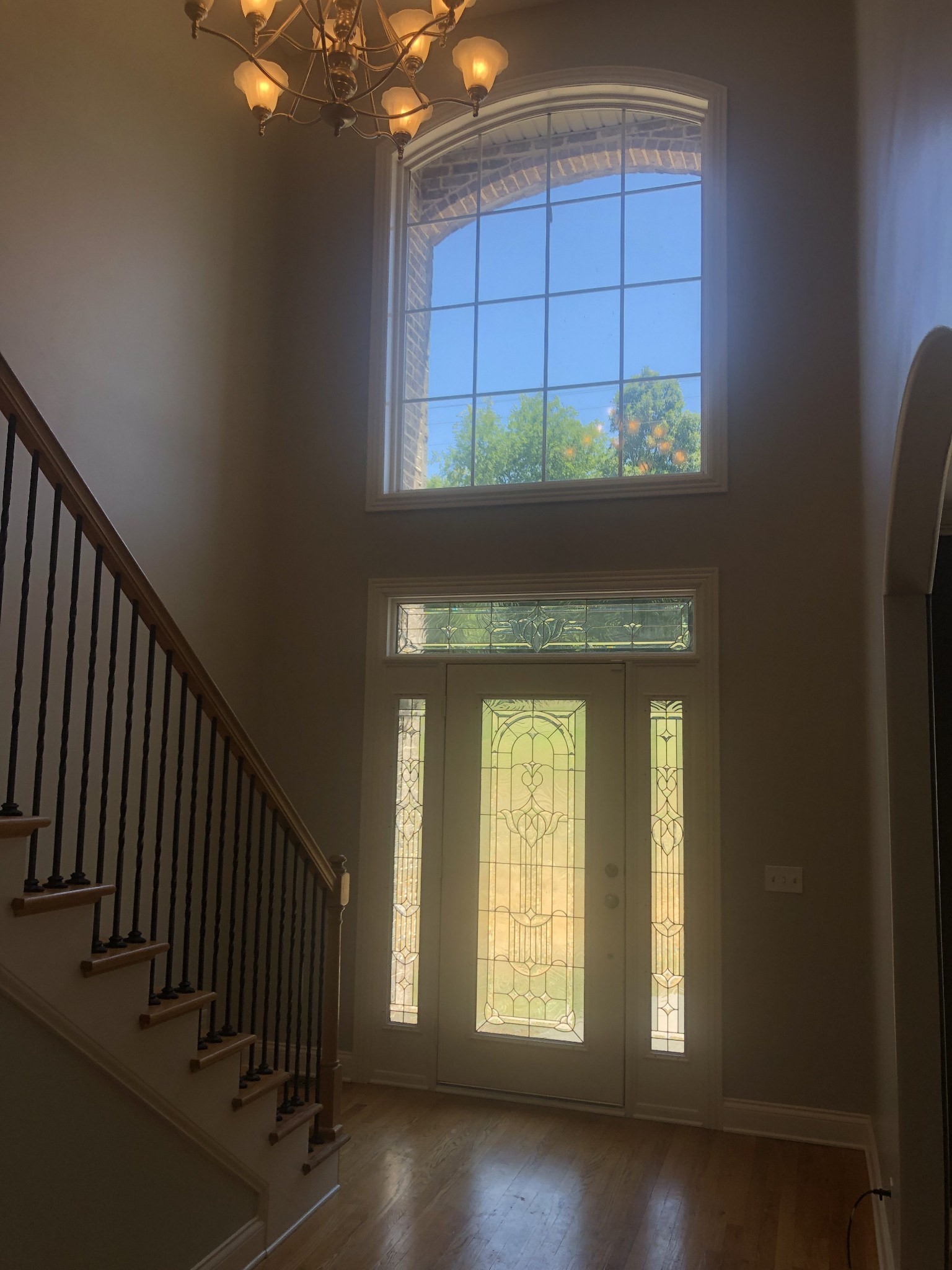 242 Ridgewater Way Mount Juliet, TN 37122 - Photo 12 of 24 a view of a hallway with windows and a chandelier