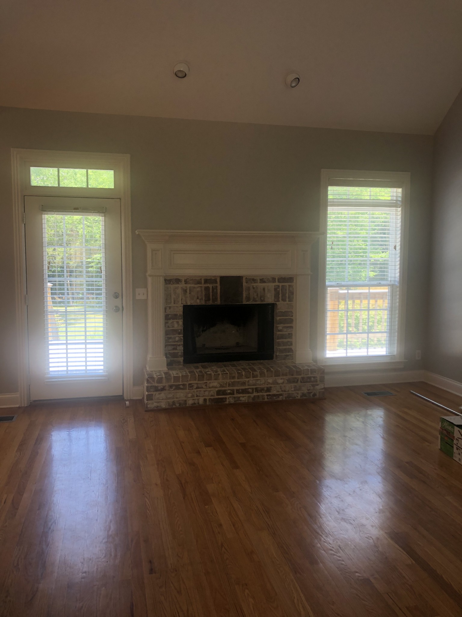 242 Ridgewater Way Mount Juliet, TN 37122 - Photo 22 of 24 an empty room with wooden floor fireplace and windows