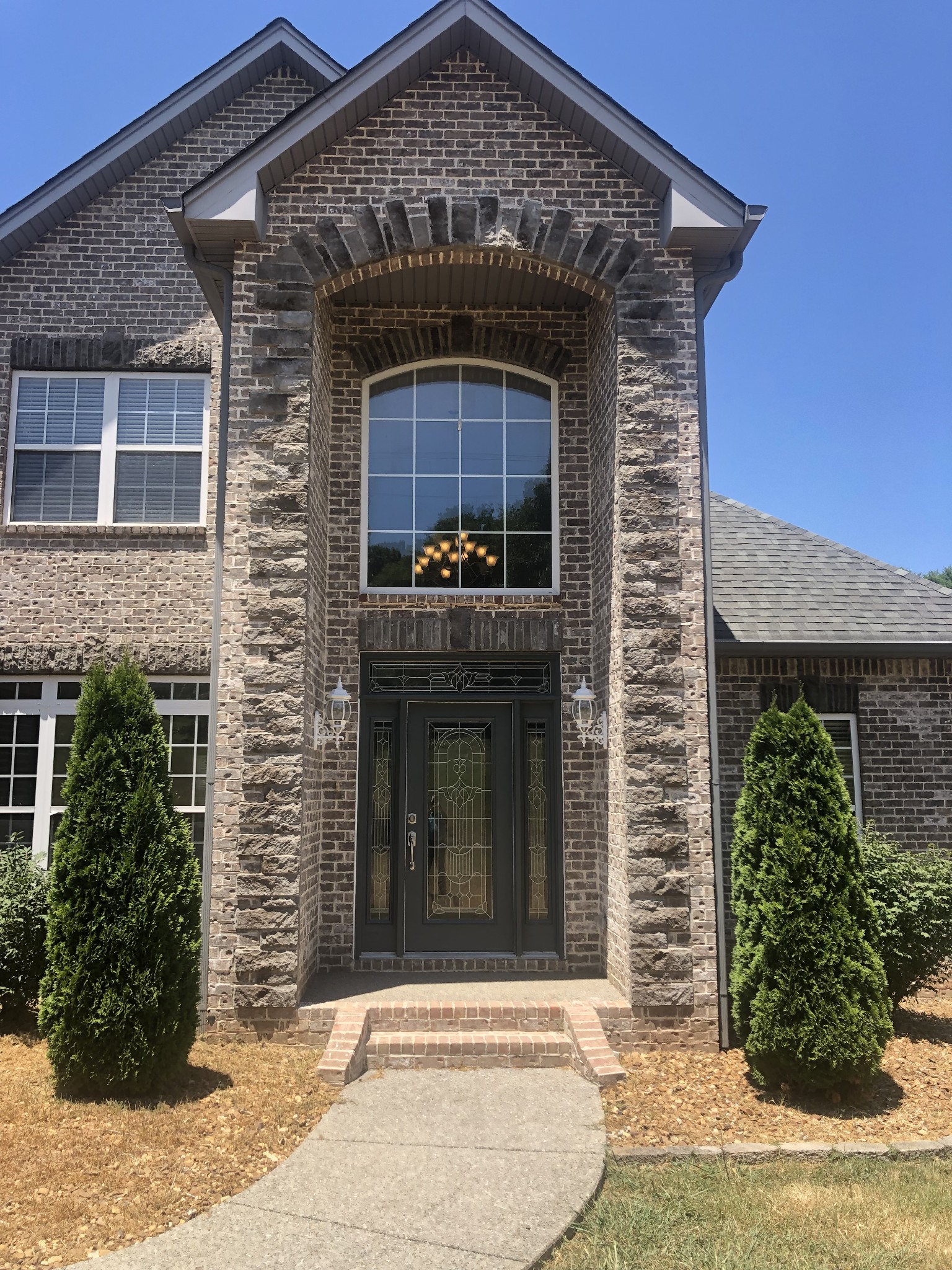 242 Ridgewater Way Mount Juliet, TN 37122 - Photo 8 of 24 a front view of a house with garden
