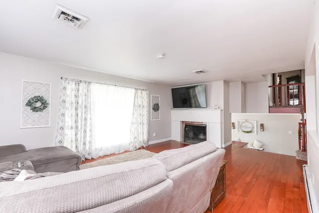 a bedroom with a bed and a fireplace