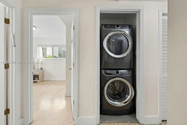 a view of a hallway with washer and dryer