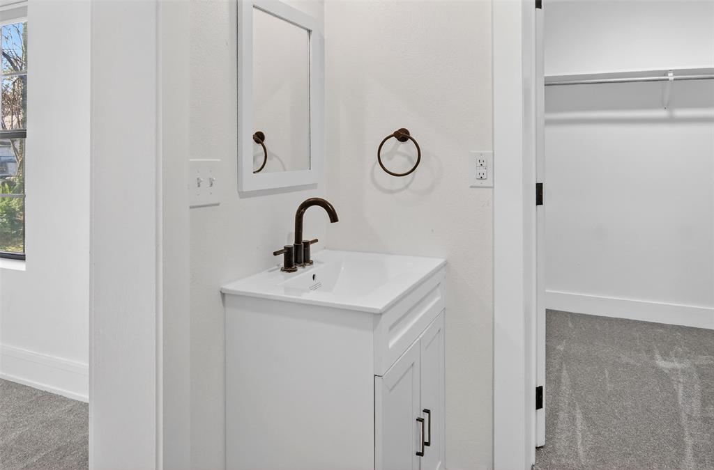 2218 Lynnhaven Road Fort Worth, TX 76103 - Photo 20 of 37 a bathroom with a sink and mirror