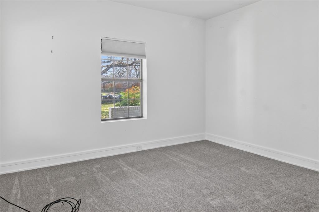 2218 Lynnhaven Road Fort Worth, TX 76103 - Photo 24 of 37 an empty room with windows