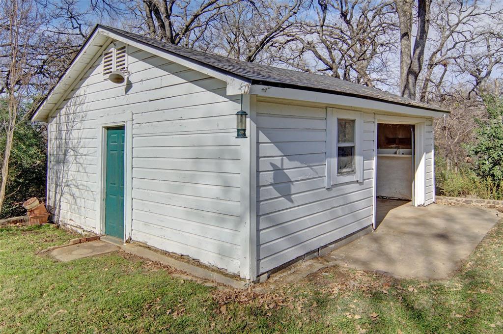 2218 Lynnhaven Road Fort Worth, TX 76103 - Photo 32 of 37 a view of a small house with backyard
