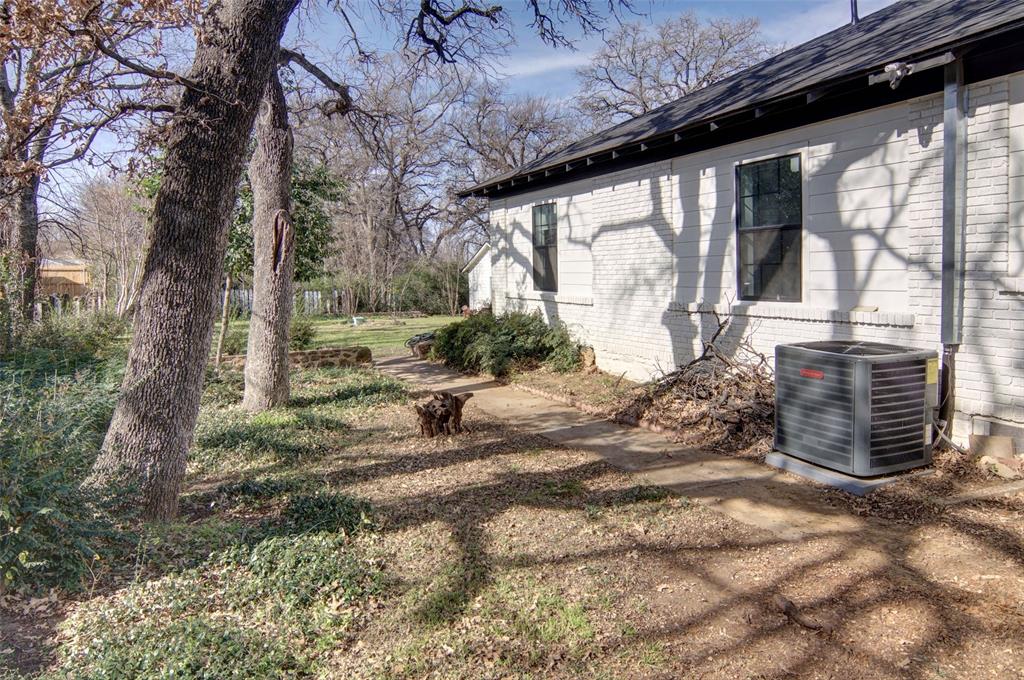 2218 Lynnhaven Road Fort Worth, TX 76103 - Photo 36 of 37 a view of a house with a yard