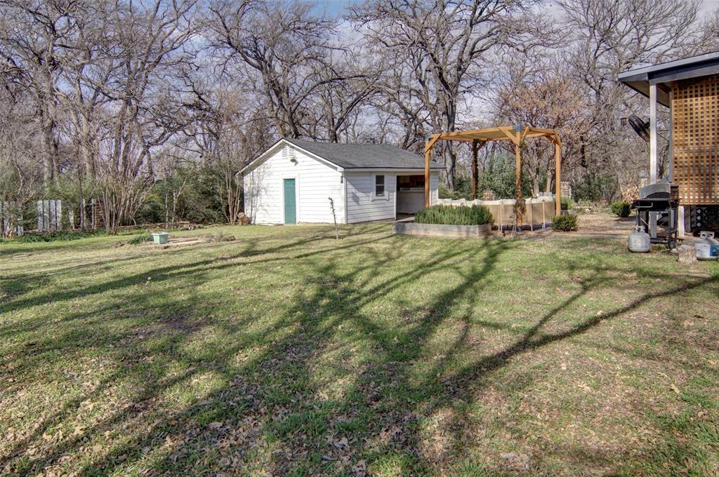 2218 Lynnhaven Road Fort Worth, TX 76103 - Photo 37 of 37 a house view with a sitting space and garden space