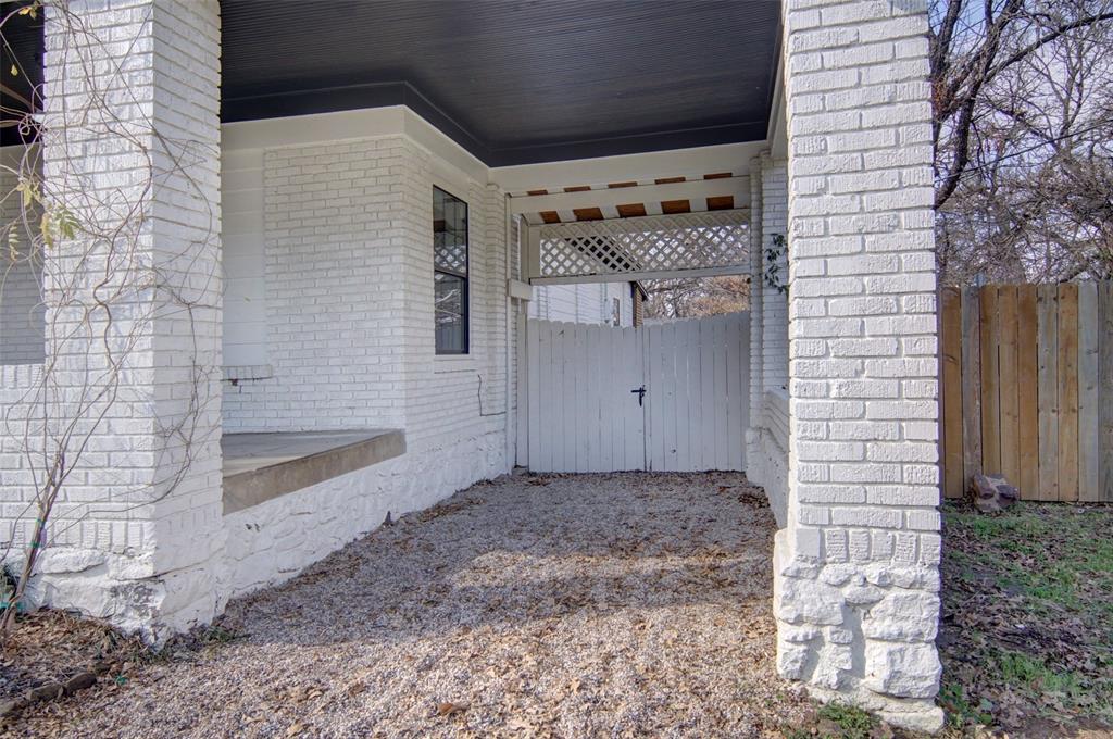 2218 Lynnhaven Road Fort Worth, TX 76103 - Photo 4 of 37 a front view of a house with a glass door
