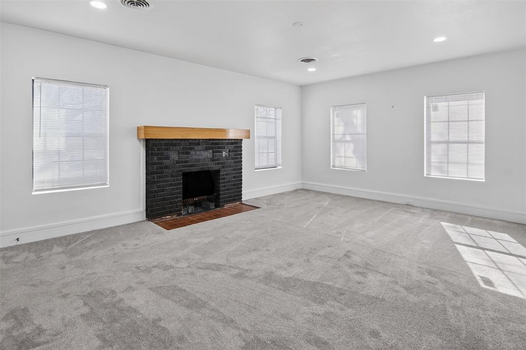 2218 Lynnhaven Road Fort Worth, TX 76103 - Photo 8 of 37 an empty room with windows and fireplace