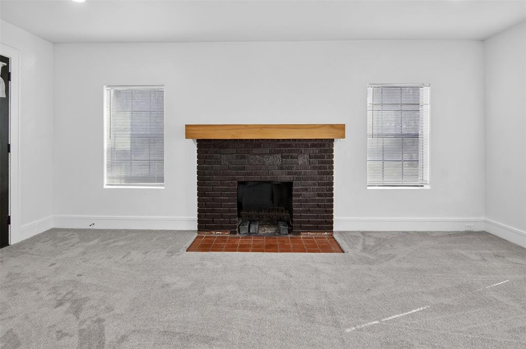 2218 Lynnhaven Road Fort Worth, TX 76103 - Photo 10 of 37 a view of an empty room with window and fire place