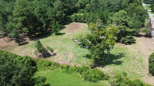 a view of a lake with a yard