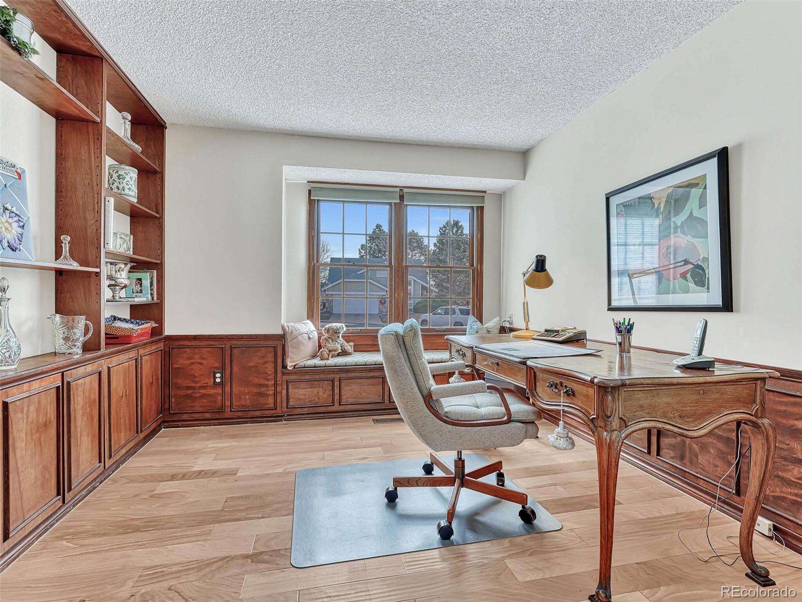 9 Stonehaven Court Highlands Ranch, CO 80130 - Photo 12 of 40 a view of a workspace with furniture and a window