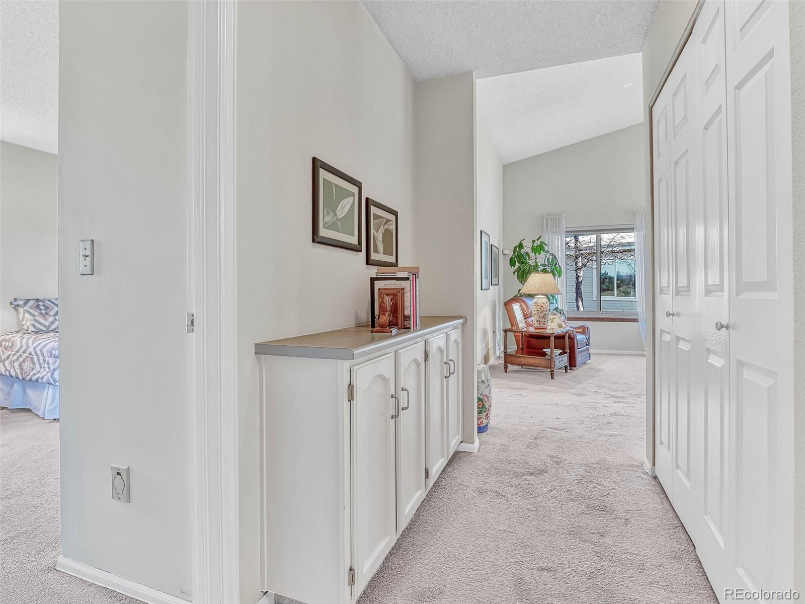 9 Stonehaven Court Highlands Ranch, CO 80130 - Photo 14 of 40 a hallway with a white stove top oven