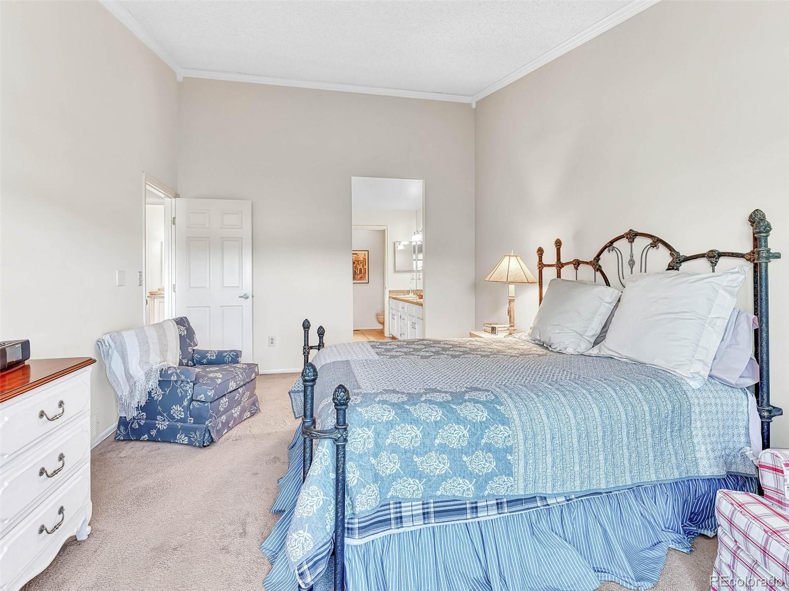 9 Stonehaven Court Highlands Ranch, CO 80130 - Photo 17 of 40 a bedroom with a bed and window