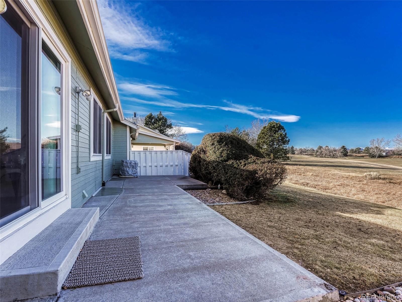 9 Stonehaven Court Highlands Ranch, CO 80130 - Photo 27 of 40 a view of a house with backyard and sitting area