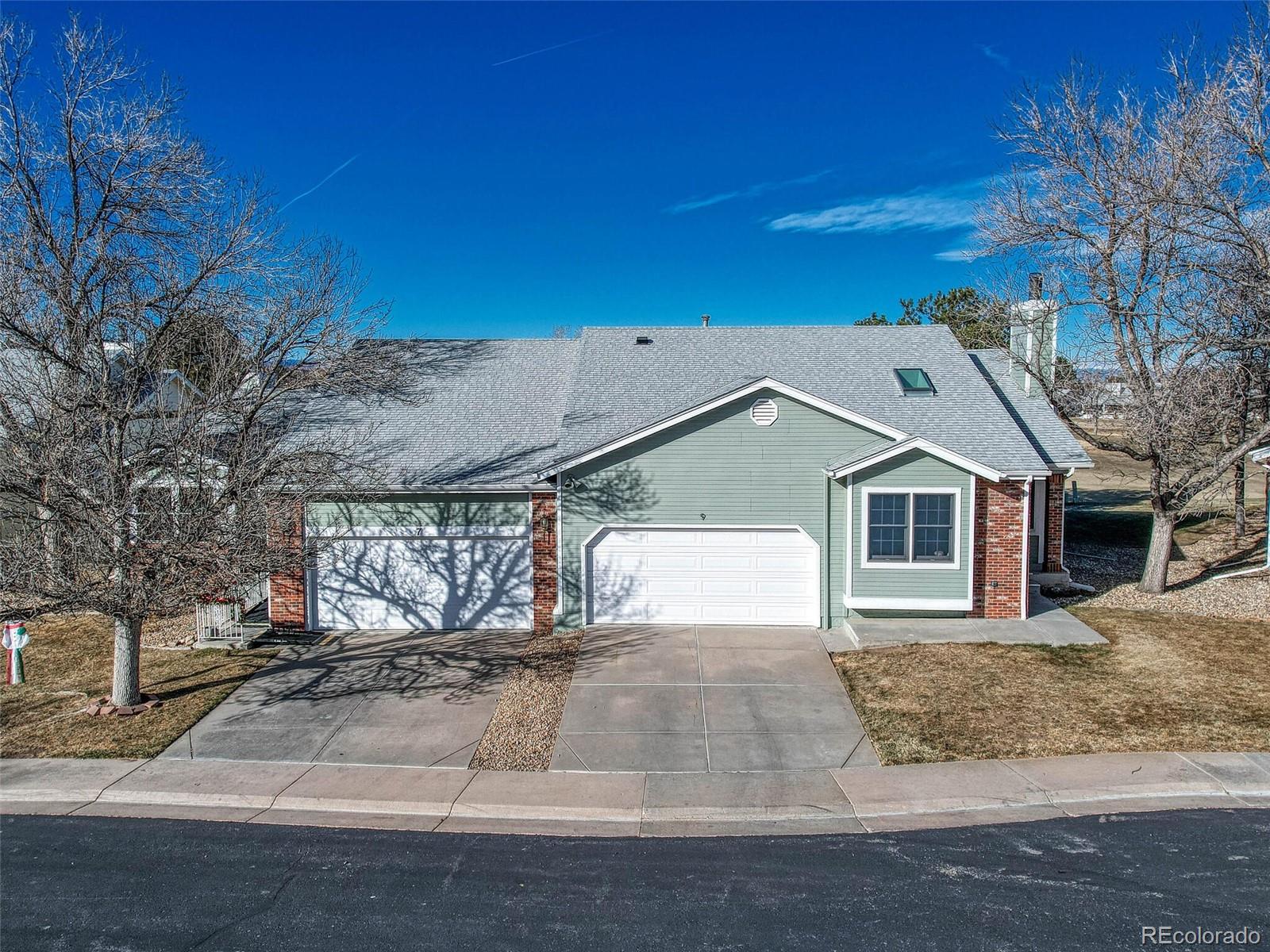 9 Stonehaven Court Highlands Ranch, CO 80130 - Photo 33 of 40 a view of a white house with a outdoor space