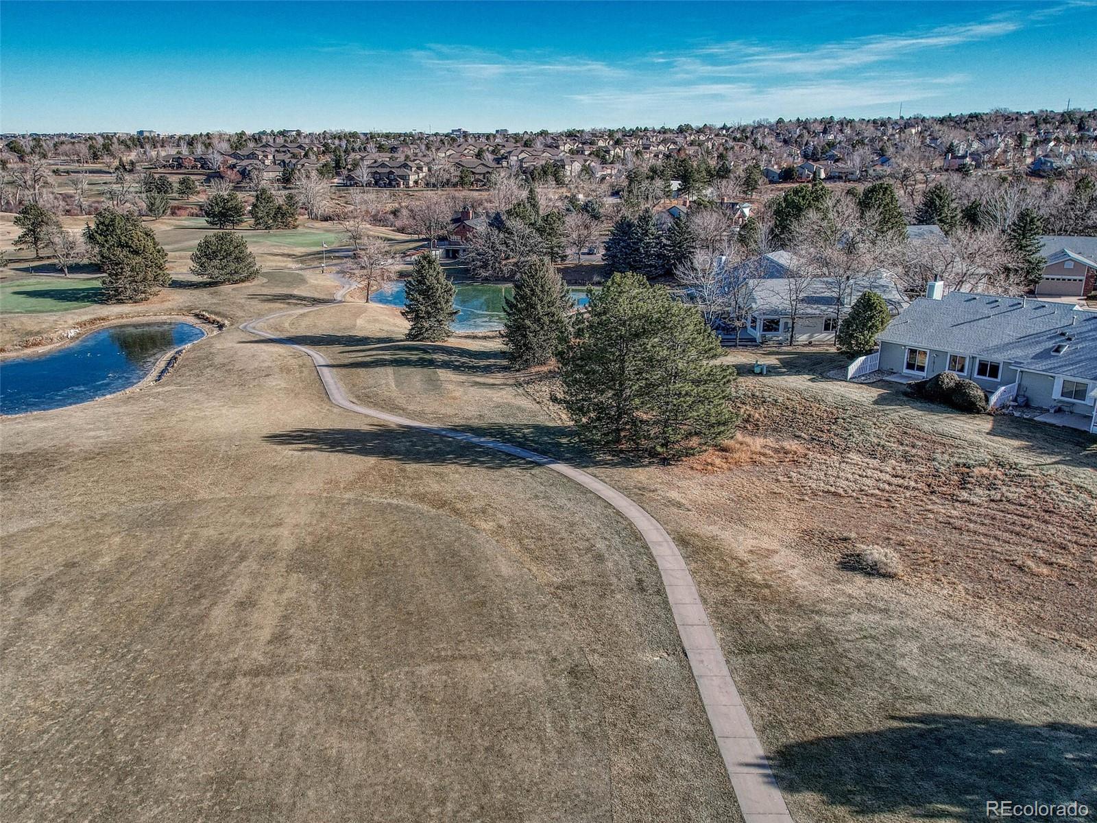 9 Stonehaven Court Highlands Ranch, CO 80130 - Photo 37 of 40 an aerial view of a house with a yard