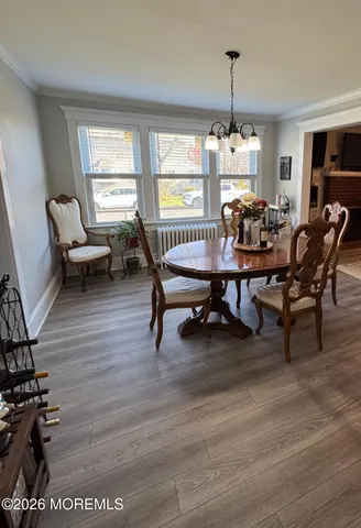 a living room with furniture dining table and a window