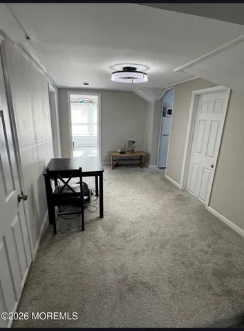 a view of livingroom with furniture and window