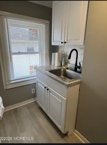 a kitchen with sink and window