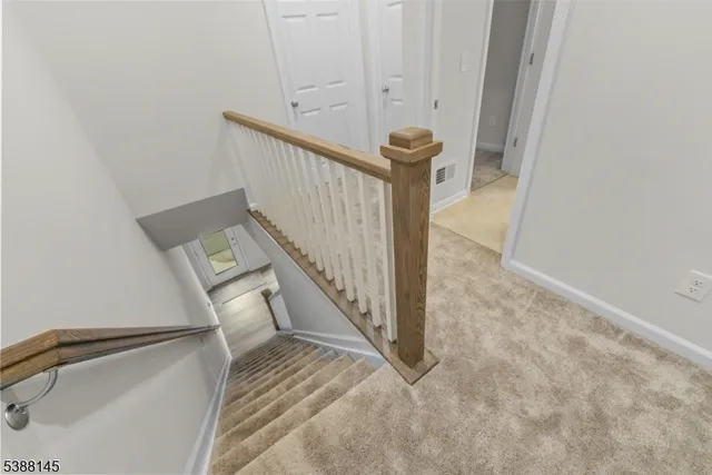 a view of a hallway with staircase