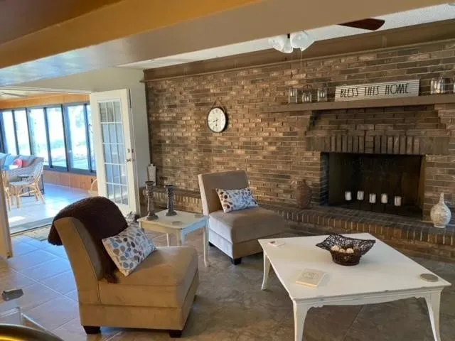 a living room with furniture and a fireplace
